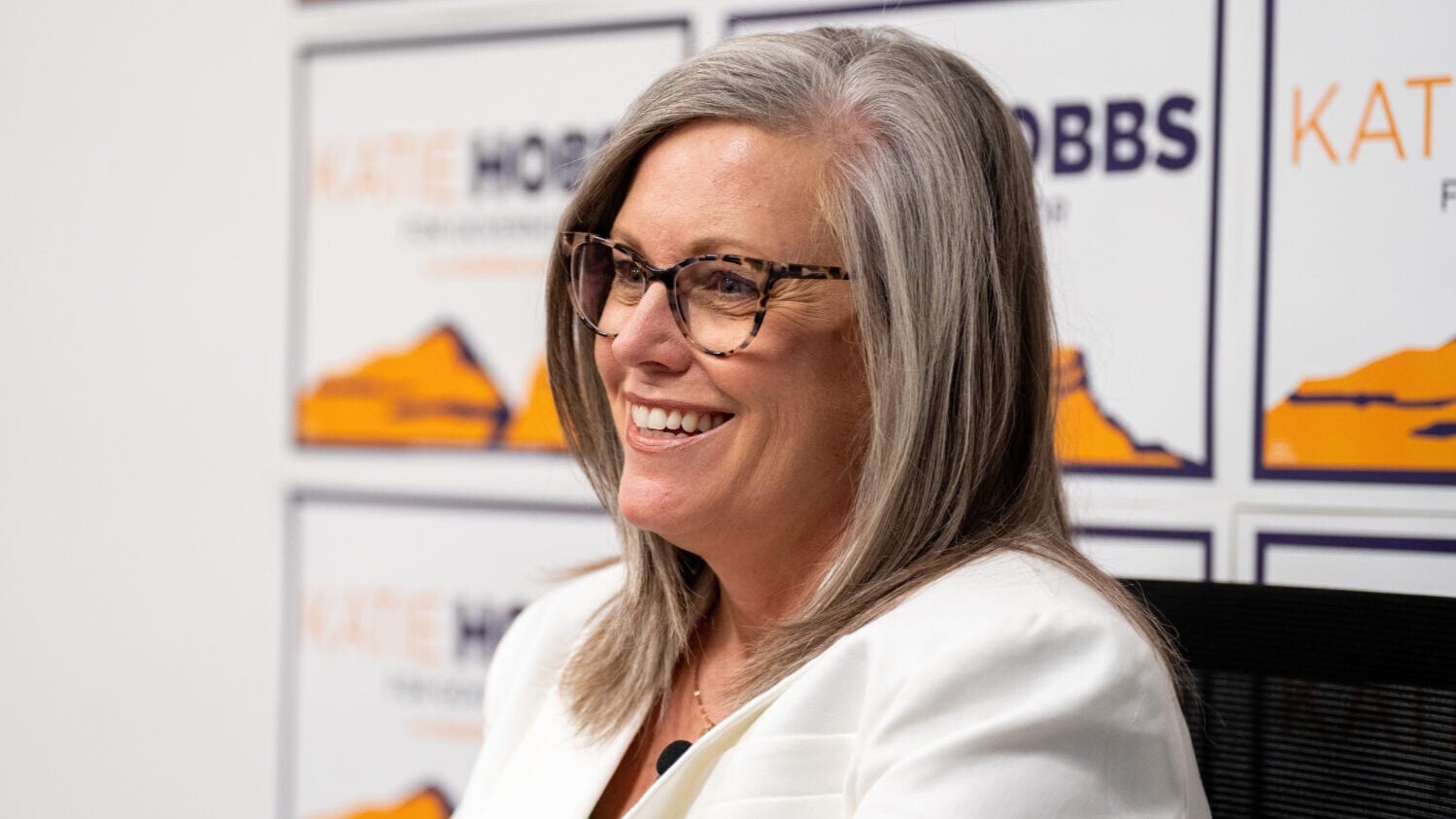Katie Hobbs smiling for a picture at a campaign office